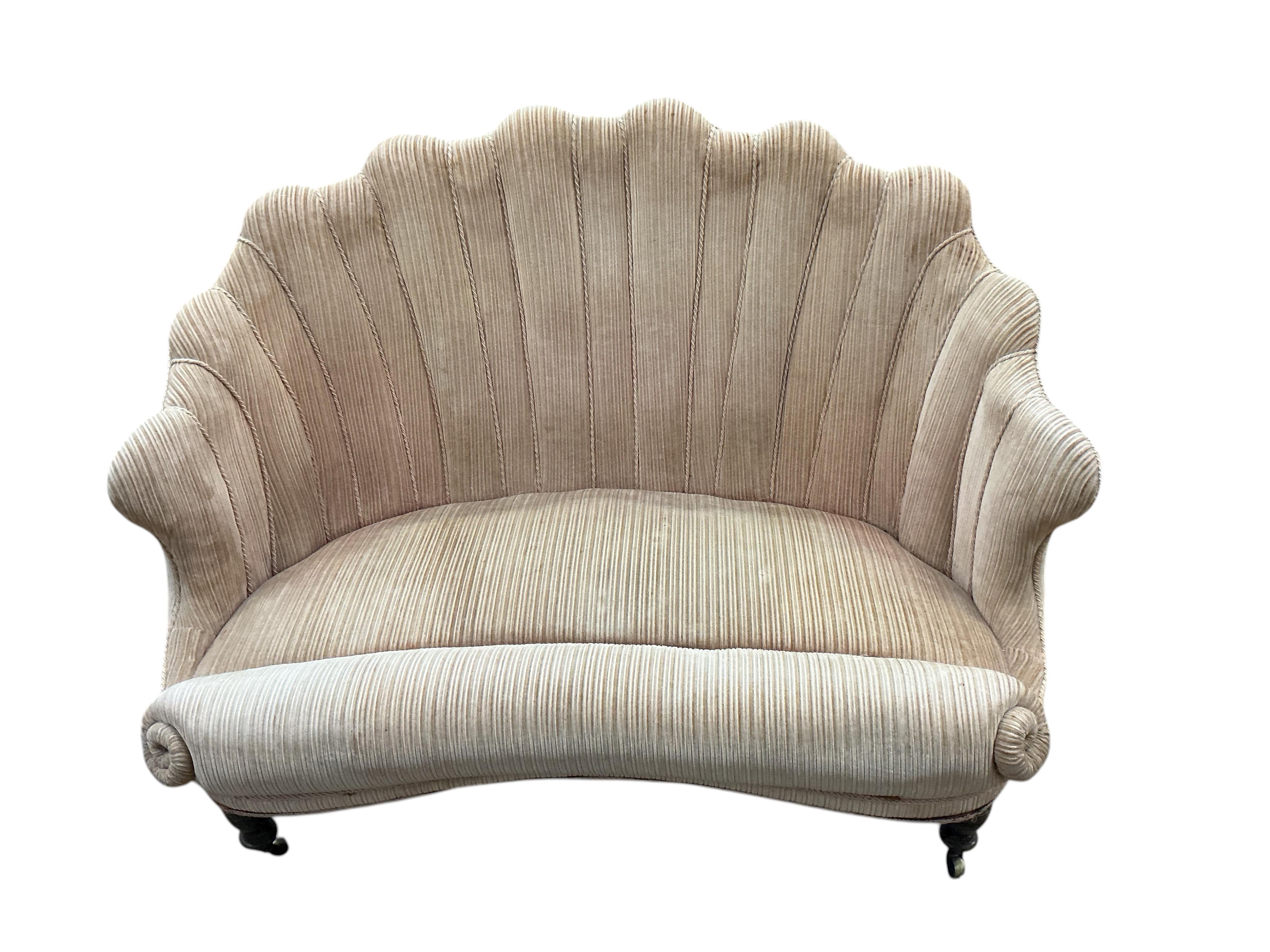 A Victorian upholstered scallop shell two seater settee on turned tapered feet, width 130cm, depth 70cm, height 85cm